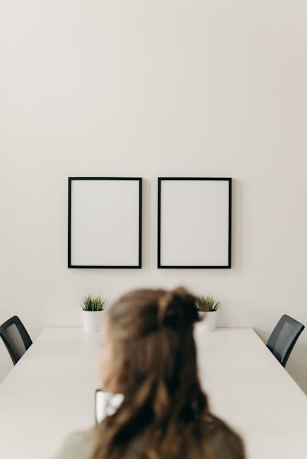 Person sitting at a clean desk, looking calm and focused.